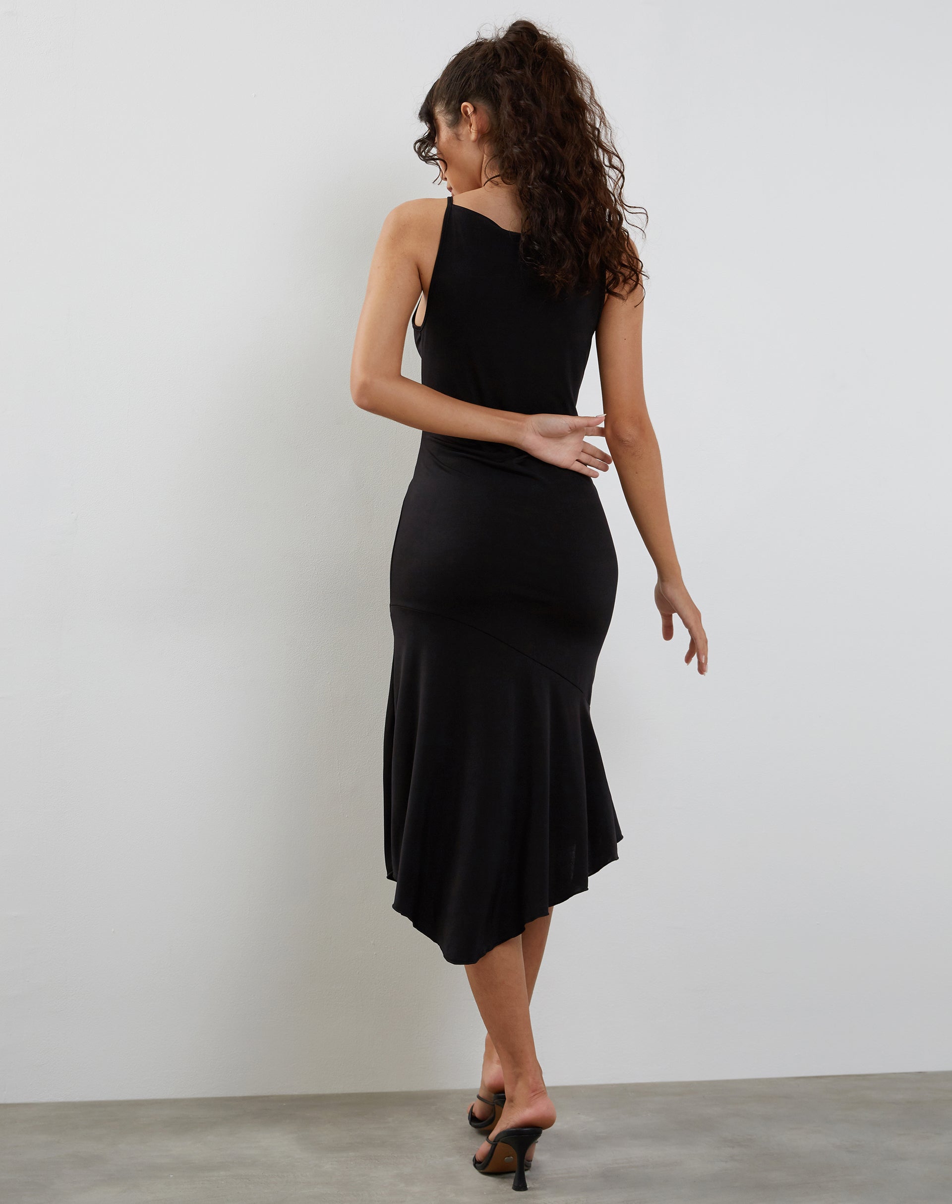 Image of Adina Asymmetric Hem Midi Dress in Slinky Black