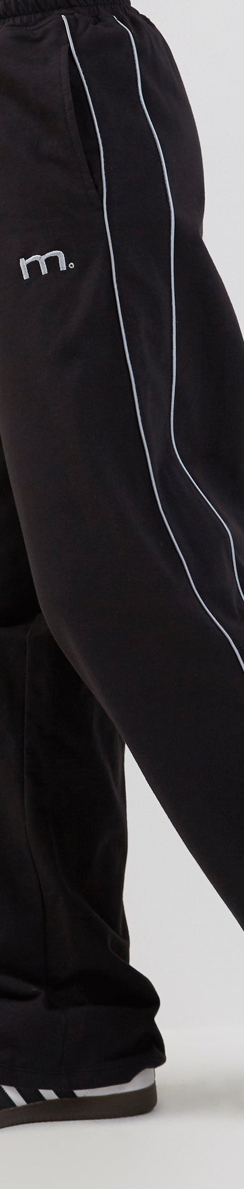 Image of Benton Wide Leg Jogger in Black with Dark Grey Piping and 'M' Embroidery