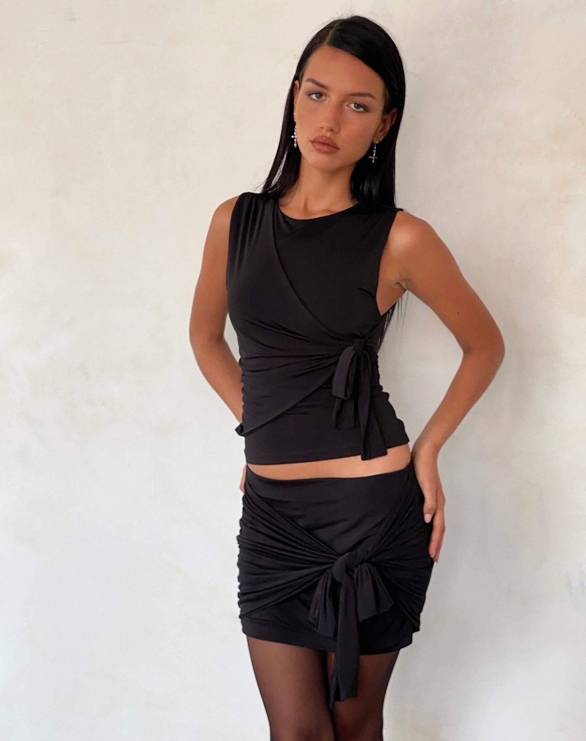 Image of Kass Bow Detail Mini Skirt in Slinky Black