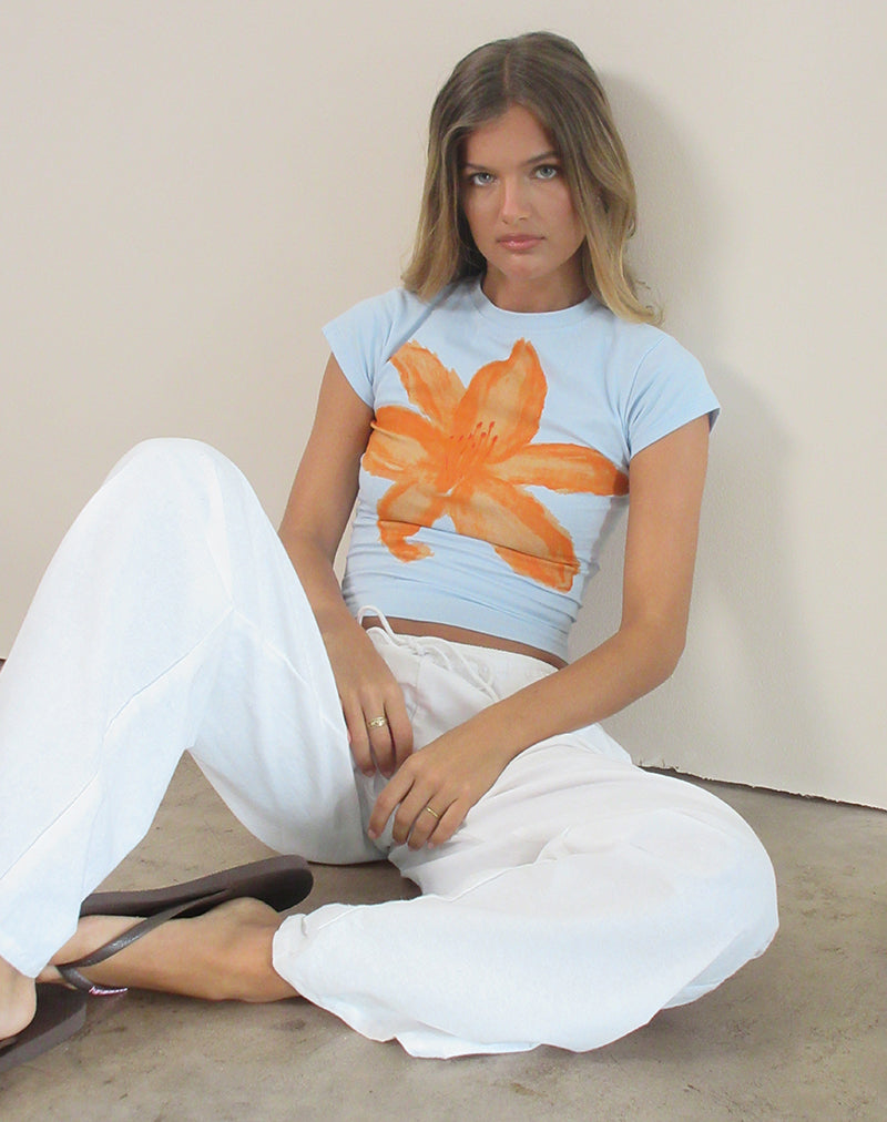 Image of Tiona Tee in Blue with Orange Painted Flower