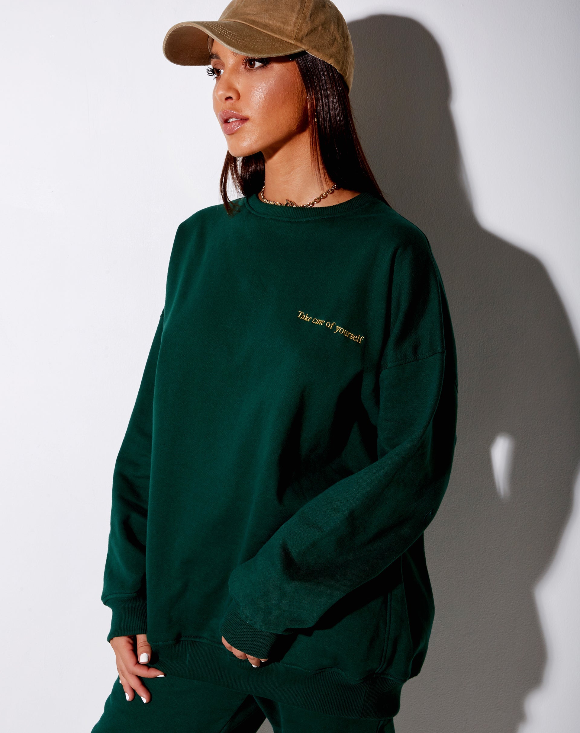 Image of Glo Sweatshirt in Bottle Green with Take Care Of Yourself Embro